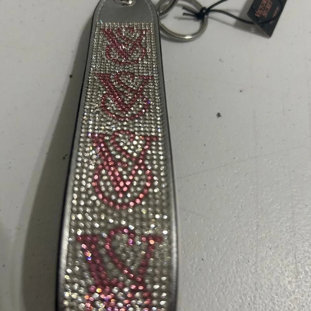 Victoria's Secret pink & silver rhinestone keychain with repeating V-shaped